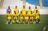 Black Starlets pose for a picture after a football match