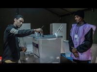 A voter casts a ballot at a polling station during the general election in Addis Ababa, Ethiopia