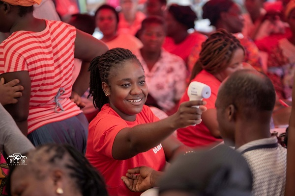 A health professional screens a beneficiary at Telecel Ghana Foundation's Healthfest in Adum, Kumas