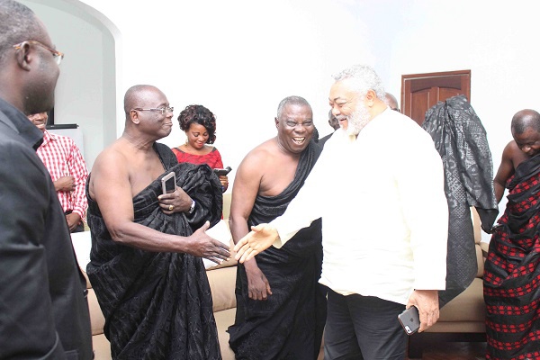 Former President JJ Rawlings interacting with family members of late JH Acheampong