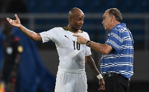 Coach Avram Grant having a chat with Andre Ayew