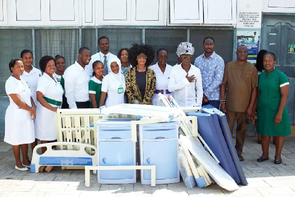 Kojo Antwi (in a scarf), donated to the hospital on his birthday