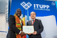 Mr. Kwame Baah-Acheamfuor receiving the Certificate of Recognition
