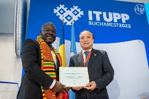 Mr. Kwame Baah-Acheamfuor receiving the Certificate of Recognition