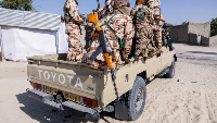 Chadian soldiers from the anti-terrorist unit travel in the back of a vehicle