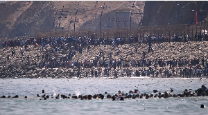 Migrants swim to Spain's Ceuta from Morocco in mass crossing
