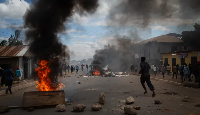 People protest in the streets of Arusha, Tanzania, on election day on October 29, 2025