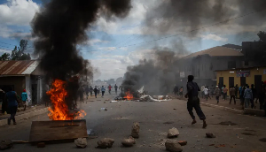People protest in the streets of Arusha, Tanzania, on election day on October 29, 2025