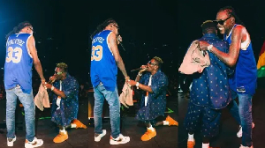 Shatta Wale kneeling before his 'idol', Vybz Kartel on stage