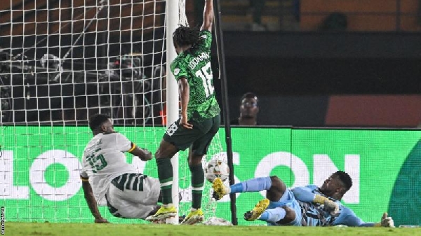 Cameroon defender Oumar Gonzalez could not keep out Ademola Lookman's first-half effort for Nigeria