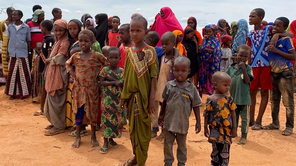 Internally displaced Somali children gather outside their makeshift shelters