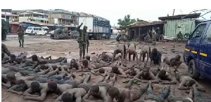 Civilian being brutalised by soldiers