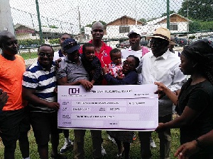 The team presented a cheque to Mrs. Barbara Mahama