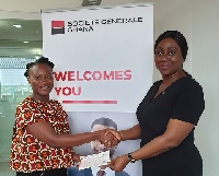 General Manager of SG Ghana presenting the cheque to Kaya Childcare Centre