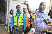 Ibrahim Mahama (right) conducting the media round the facility in Tema