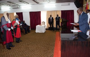 Mahama administering the oath of office to the newly appointed Justices of the Supreme Court