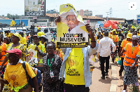 [1/5]Supporters of Uganda's President and the leader of ruling NRM party march along the streets