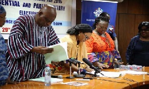 Electoral commissioners sorting out documents of political parties