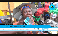 A picture of a marking woman speaking with a journalist from Ghanaweb