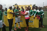 Skipper of the winning team(M) receiving the silverware from Laurinda(R) and Mustapha