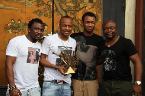 Abedi Pele with his sons