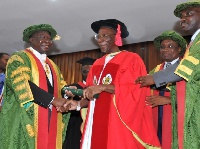 Otumfuo patting Prof. William Otoo-Ellis, VC of KNUST