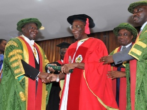 Otumfuo patting Prof. William Otoo-Ellis, VC of KNUST