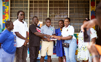 Stonebwoy and his team making the presentation to Holyfield Odorba