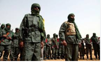Malian troops join with former rebels before a joint  patrol in Gao, Mali in Feb. 23, 2017