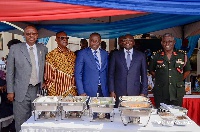 Vice President Dr. Mahamudu Bawumia serving food to soldiers lined up in a queue