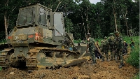 Military engineers rehabilitate the Mbau-Kamango road in the district of Beni, DRC