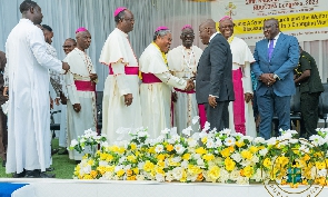 President Akufo-Addo greets Catholic priests at an event