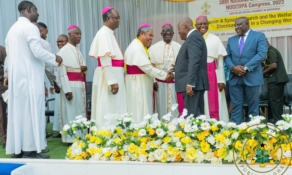President Akufo-Addo greets Catholic priests at an event