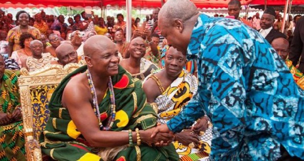 An old photo of Togbe Afede XIV (L) exchanging pleasantries with John Dramani Mahama