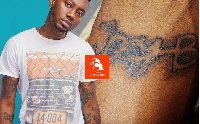 Pappy Kojo's latest ink can be found on the upper wrist-arm of the rapper.
