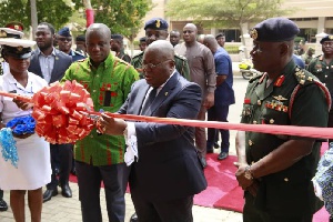 Presiden Akufo-Addo performing the tape cutting ceremony when he addressed Service Chiefs, Officers
