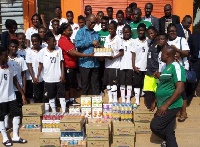 The Ivory Coast Ambassador presented the items to the team after their training session