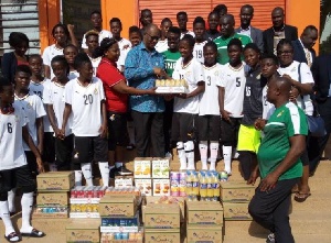 The Ivory Coast Ambassador presented the items to the team after their training session