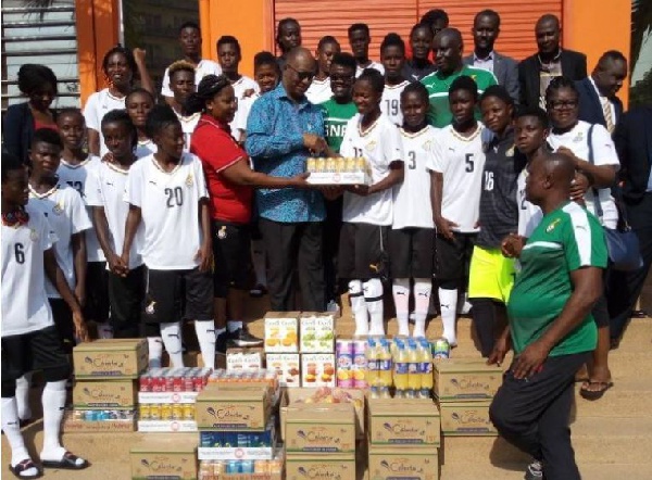 The Ivory Coast Ambassador presented the items to the team after their training session