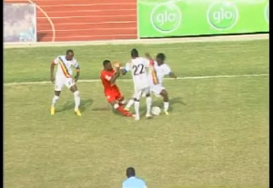 Laryea is seen here stepping on the leg of Baba Rahman