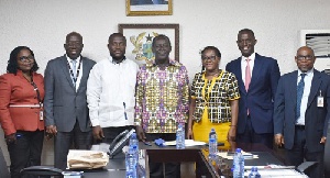 Dr Addo Kufuor (middle) and Nii Adjei Sowah in a pose with other officials