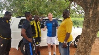 Frank Nuttall meets his technical team before training starts on Wednesday