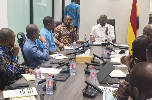 Energy minister John Jinapor in brown shirt with  Dr. Cassiel Ato Forson