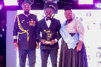 Harrison Boadu Barnoh (middle) receiving the award