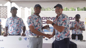 Vincent Torgah receiving his winner’s trophy from Hans De Beer, president of PGA Ghana