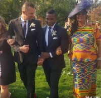 Stephen going to the altar arms in arms with his lover and mother (in Kente)