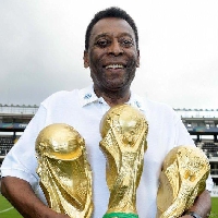 Pele with this three World Cup trophies