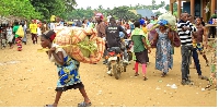 Some of the Congolese refugees with their property in Bundibugyo District on Wednesday.