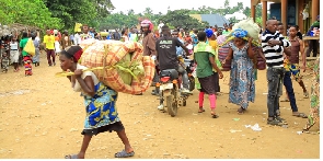 Some of the Congolese refugees with their property in Bundibugyo District on Wednesday.