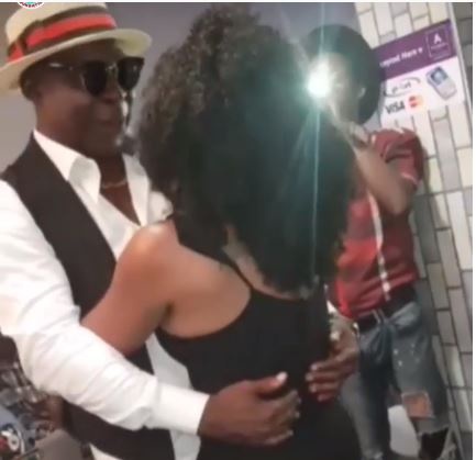 Veteran actor Kofi Adjorlolo captured holding tight to a lady as they dance